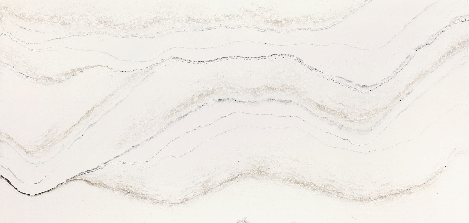 A close up of a white granite counter top with a marble texture.