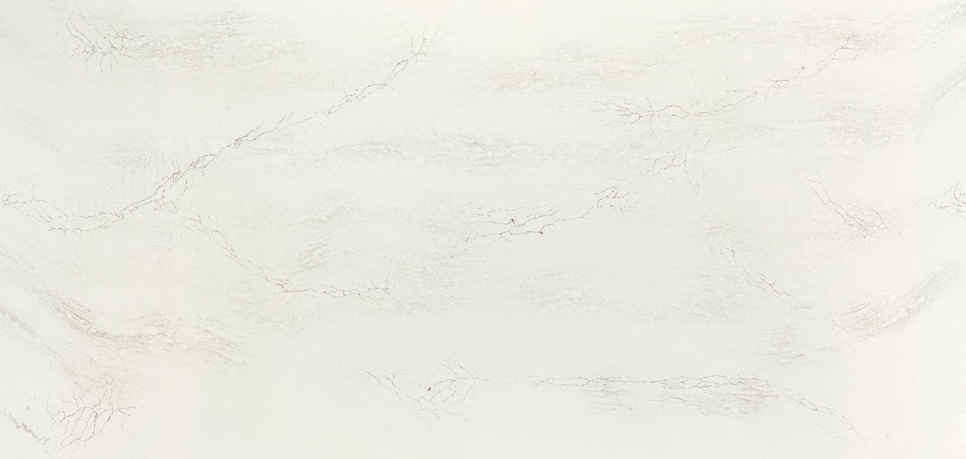 A close up of a white marble counter top.