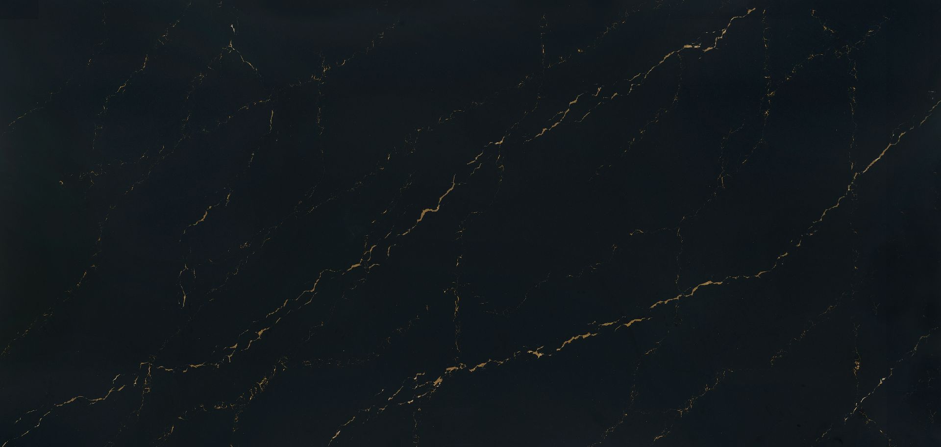 A close up of a black granite counter top with white veins.
