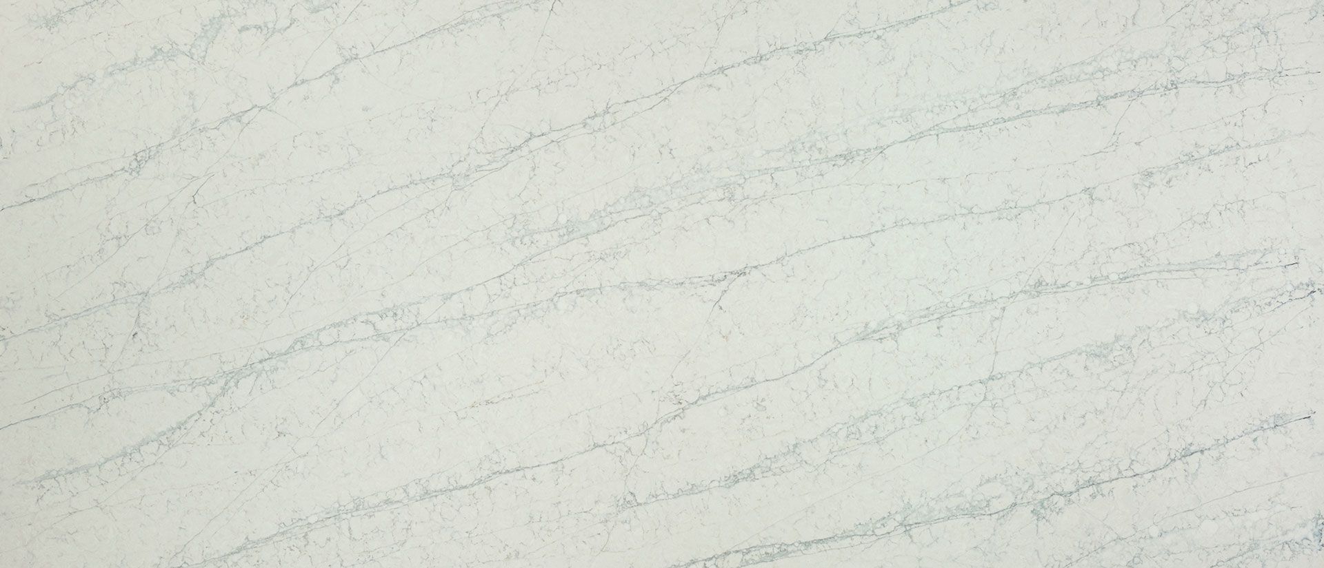 A close up of off white marble with writing on it.