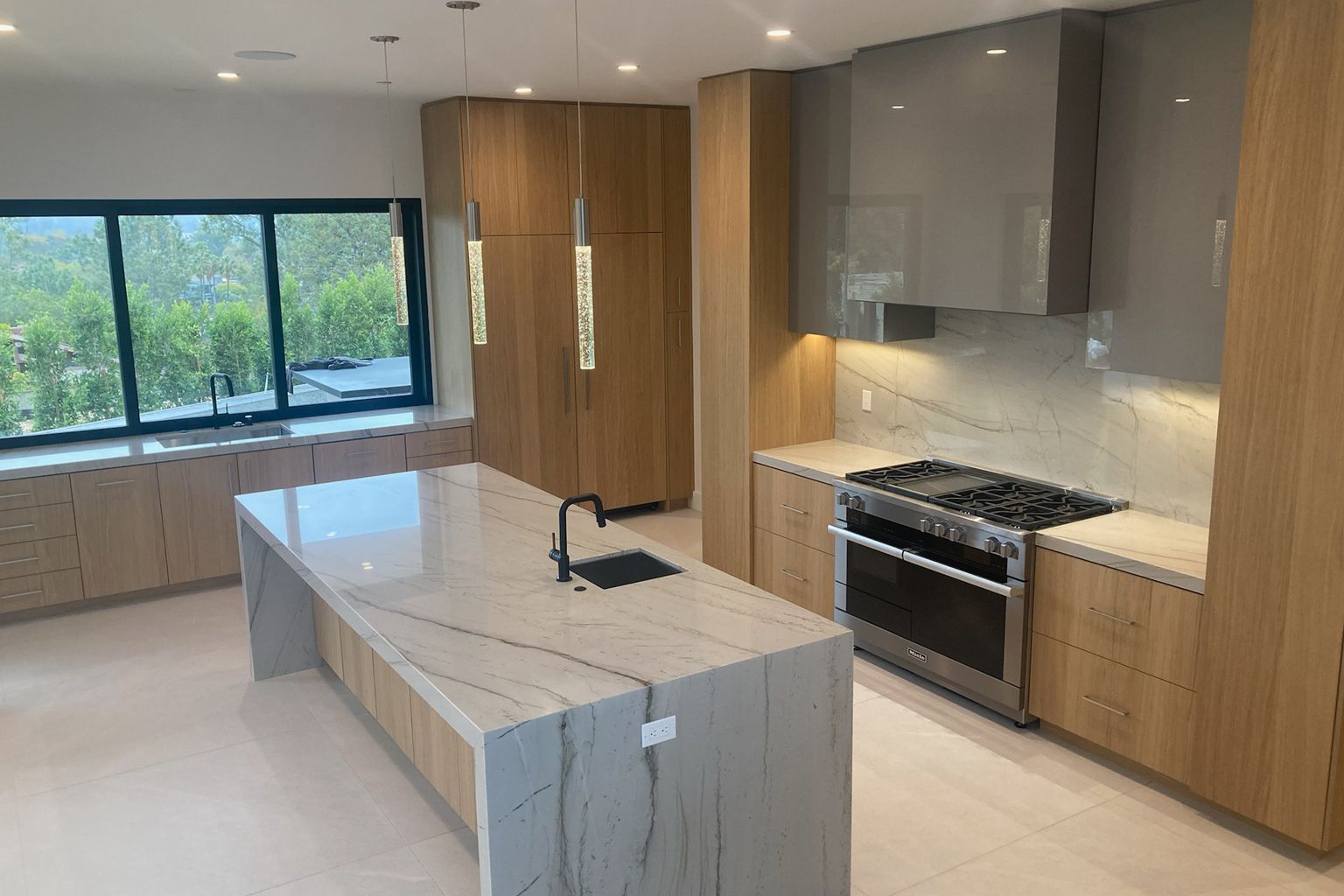 There is a large island in the middle of the kitchen.