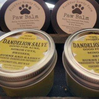 Two jars of paw balm and dandelion salve