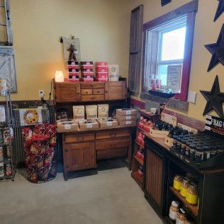 A room filled with lots of boxes on a table and shelves.