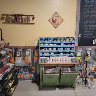 A store filled with lots of products and a chalkboard.