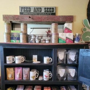 A shelf with a sign that says feed and seed on it.