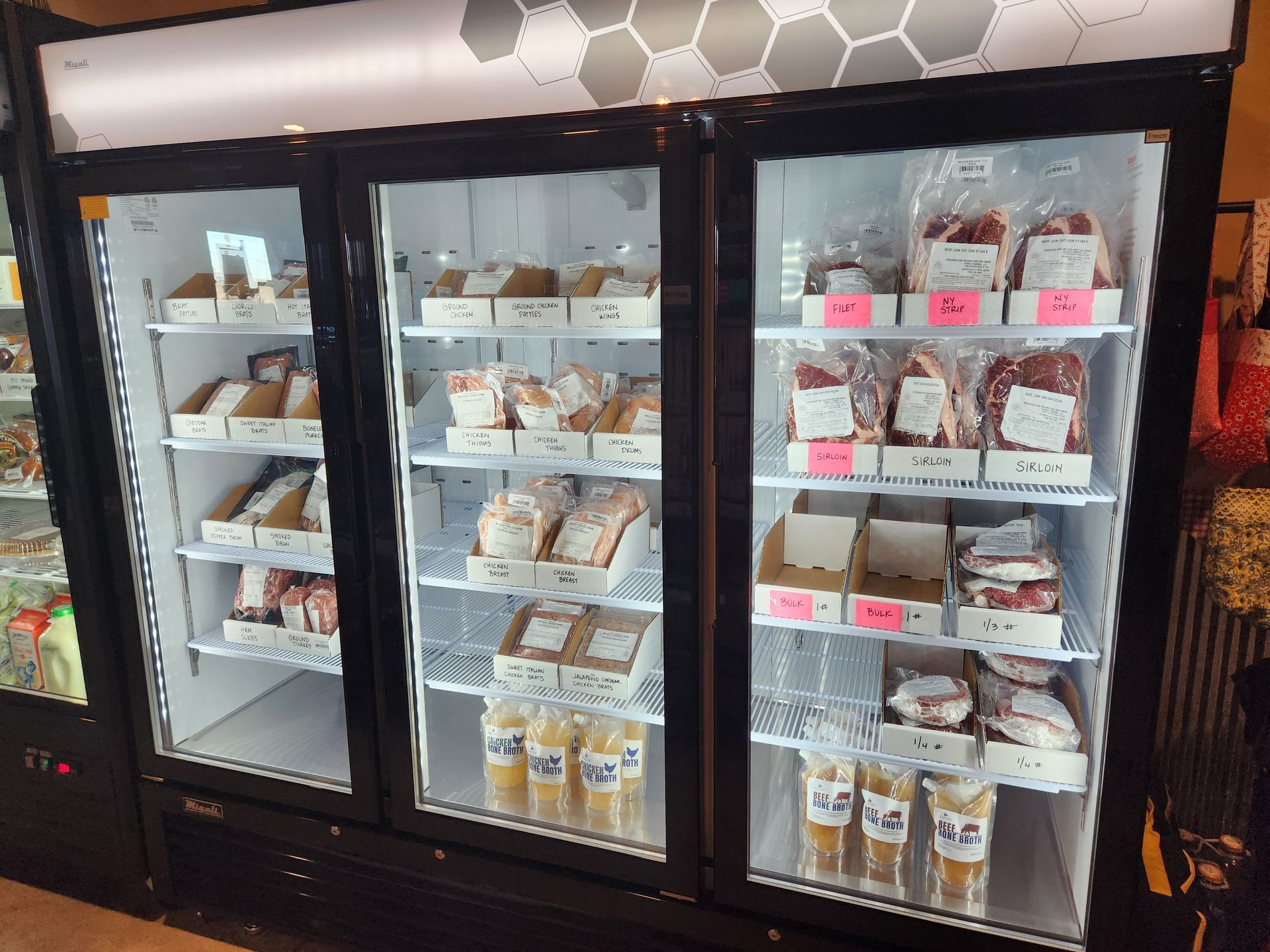 A refrigerator filled with lots of food and drinks