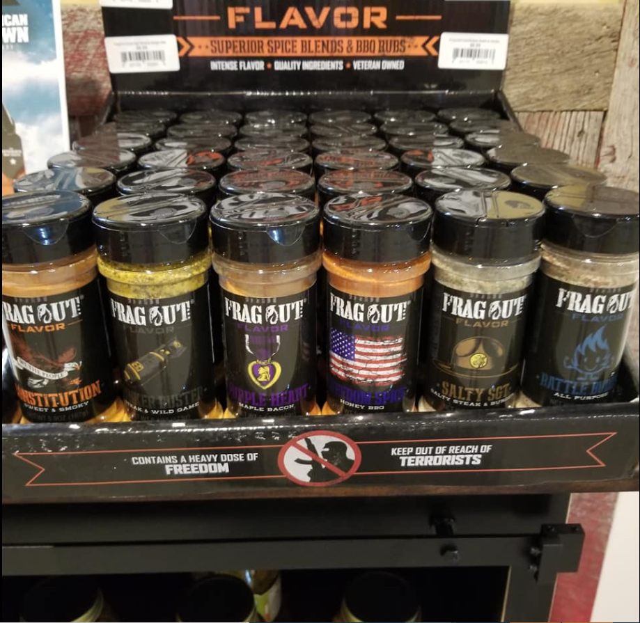 A shelf full of jars of flavor spice blends