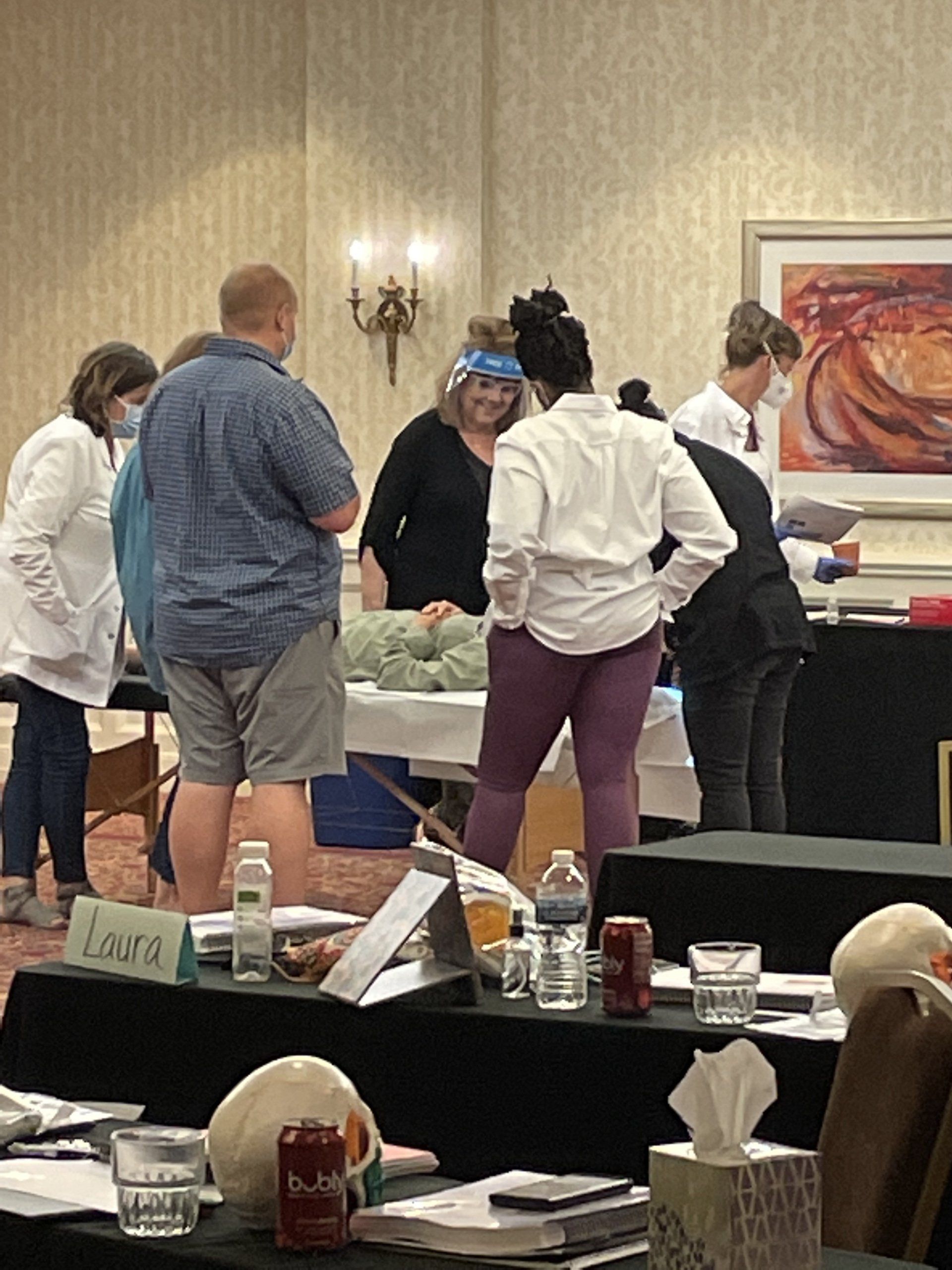 Mary Billings demonstrating on a massage table