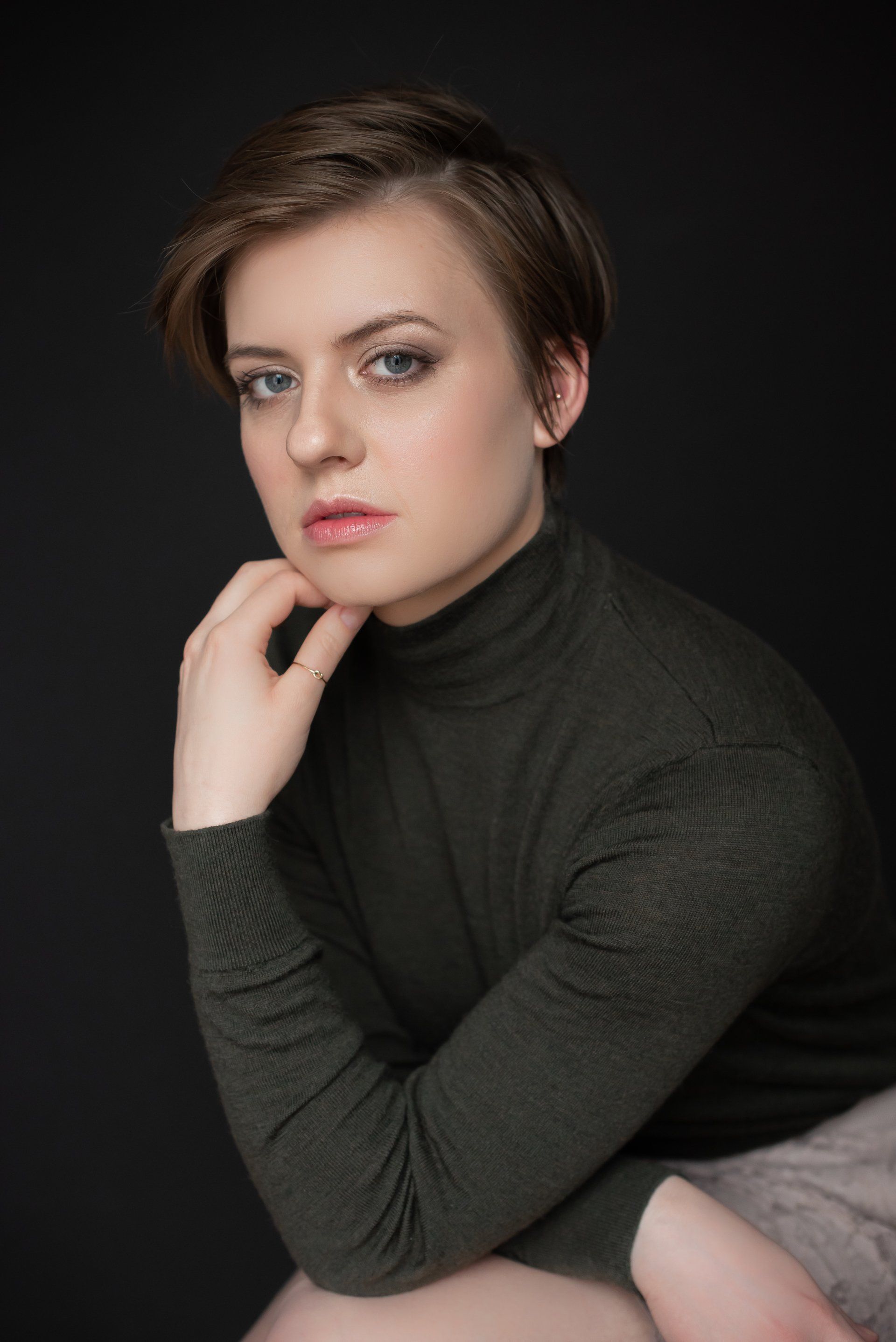 A young professional's headshot wearing a black turtleneck