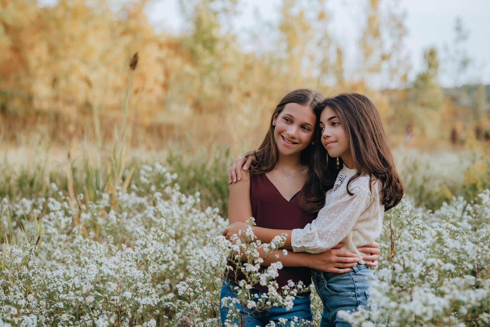 Photo of two sisters in field of wild flowers for Toronto gift idea for families