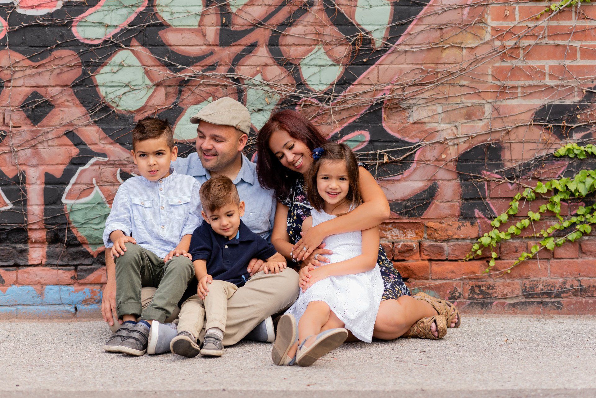 Lifestyle photography Toronto | Stacey Naglie |  Man, woman and three children in front of graffiti covered wall
