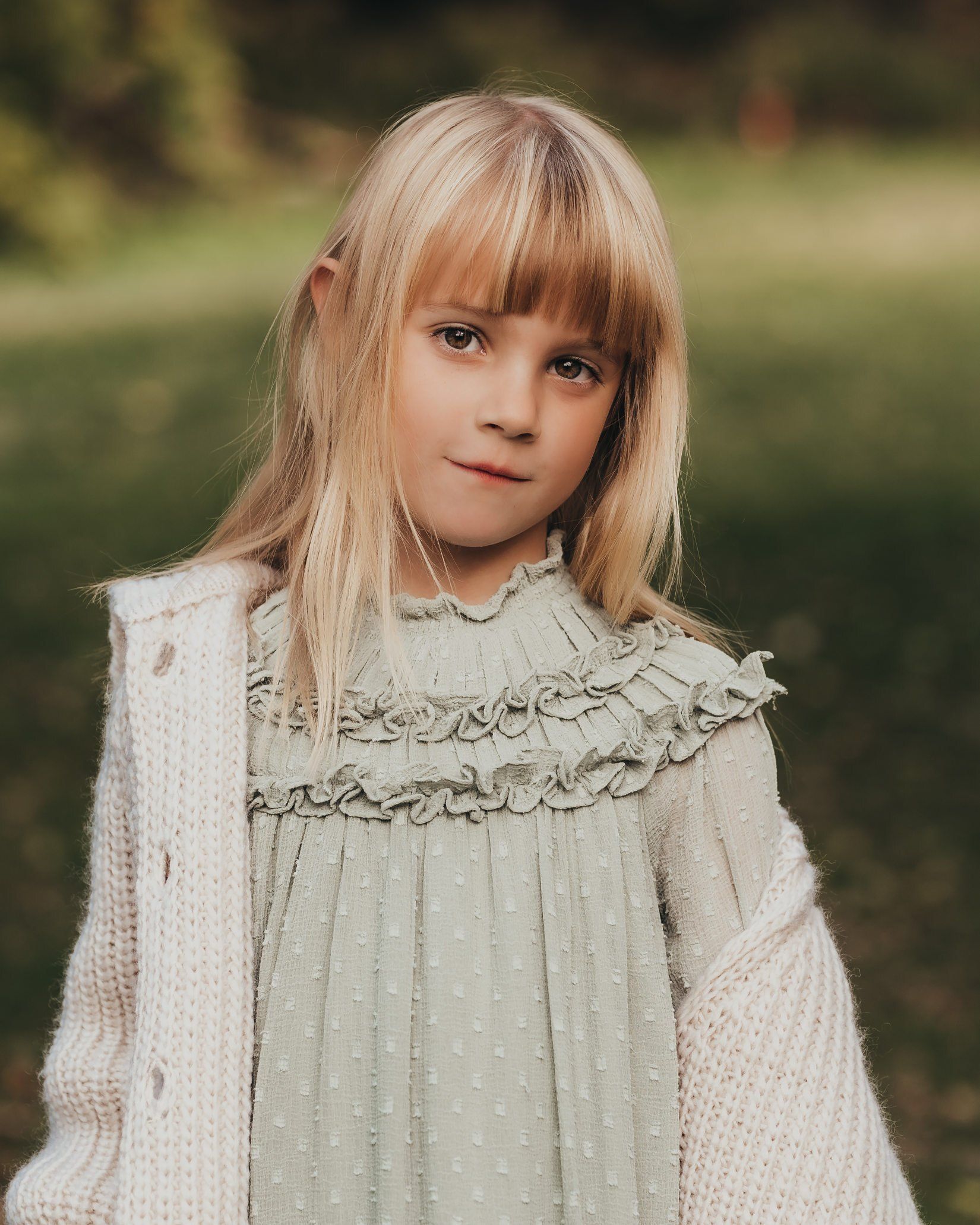 Photo of small girl standing in field for family photography