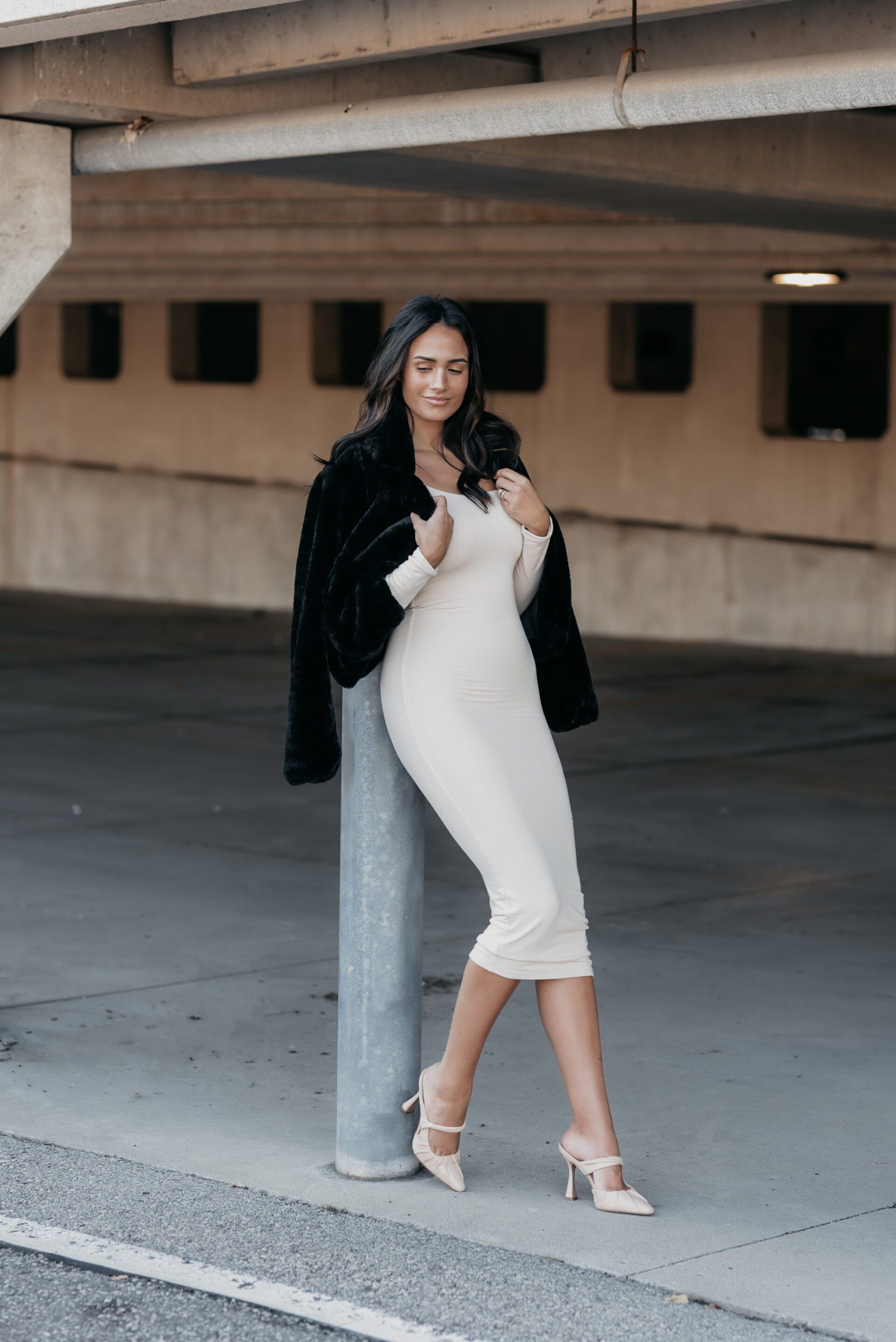 Social influencer Chantel in a white dress and black jacket