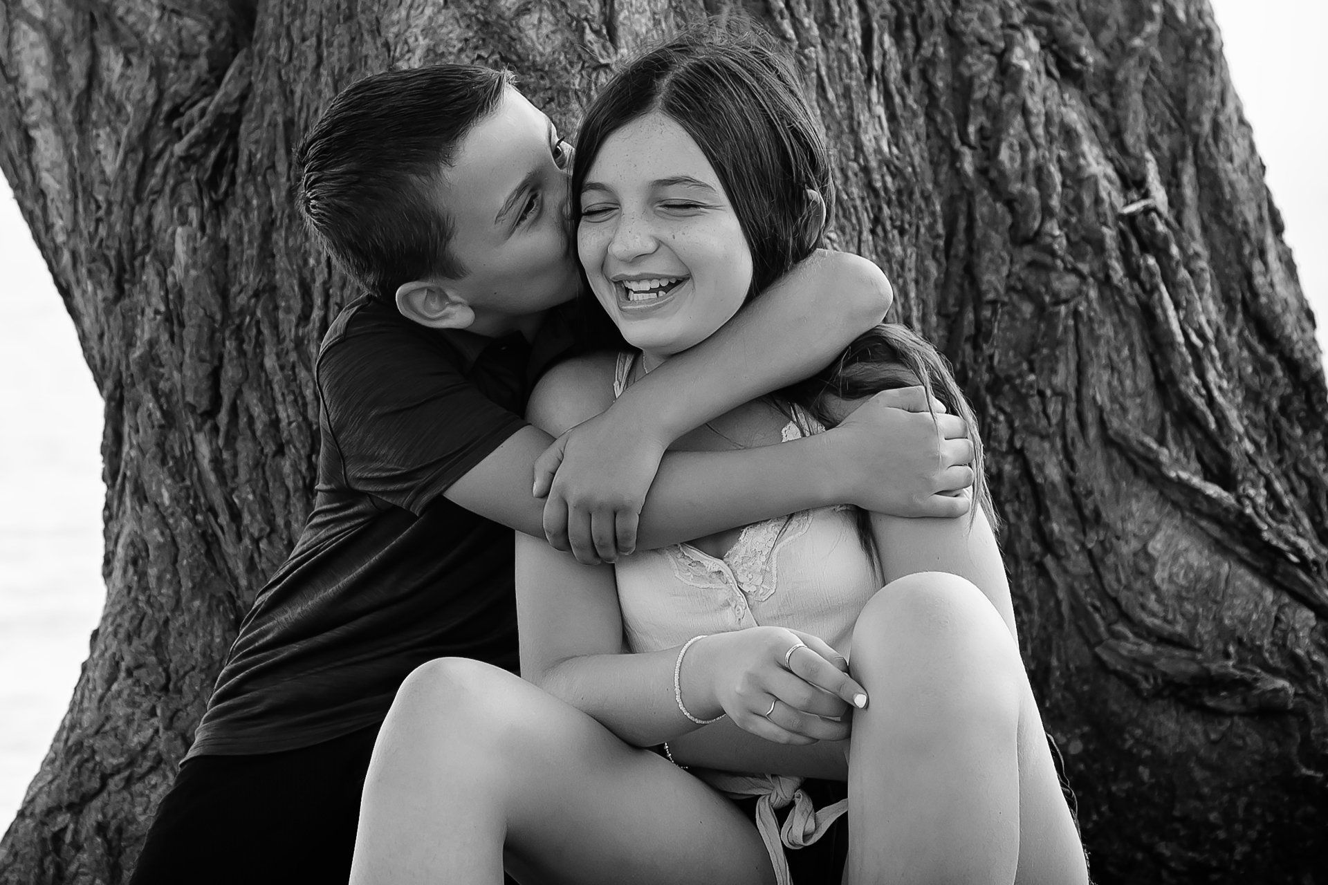 Family photographer Toronto | Stacey Naglie | Boy hugging smiling  girl