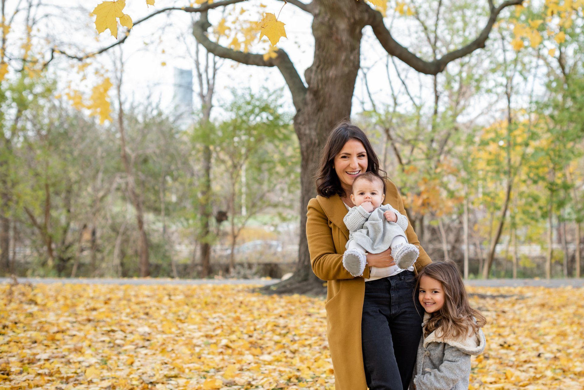 Family photographer Toronto | Stacey Naglie | Standing woman holding baby with young girl