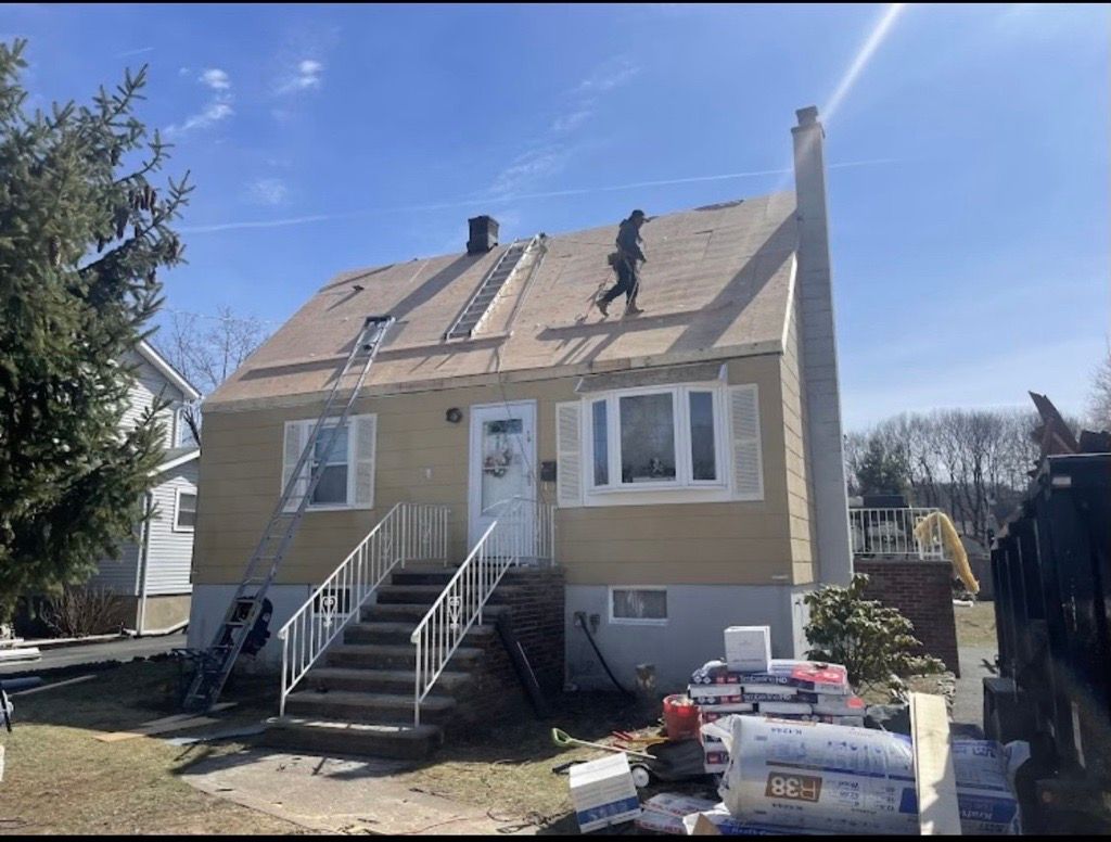 A man is cleaning a chimney with a brush.