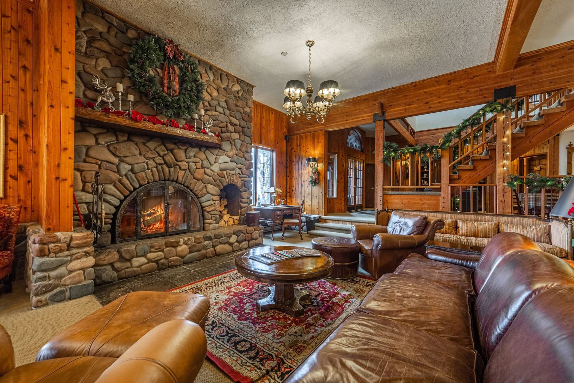 A living room filled with furniture and a fireplace.