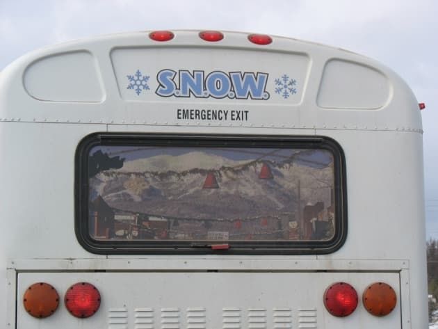 Back of a white bus with 