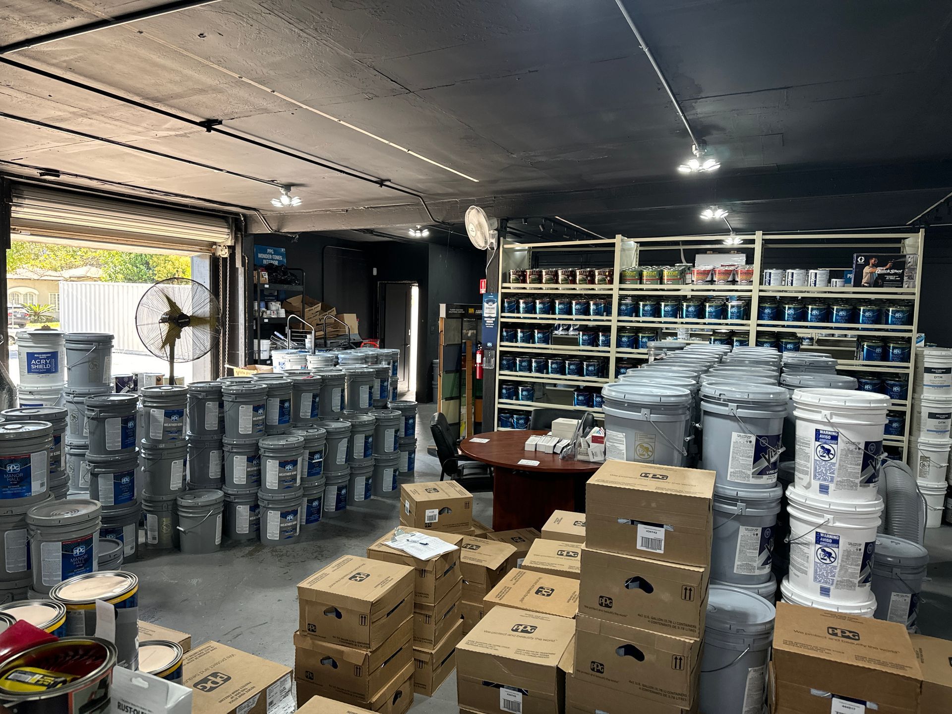 A warehouse filled with lots of buckets and boxes.