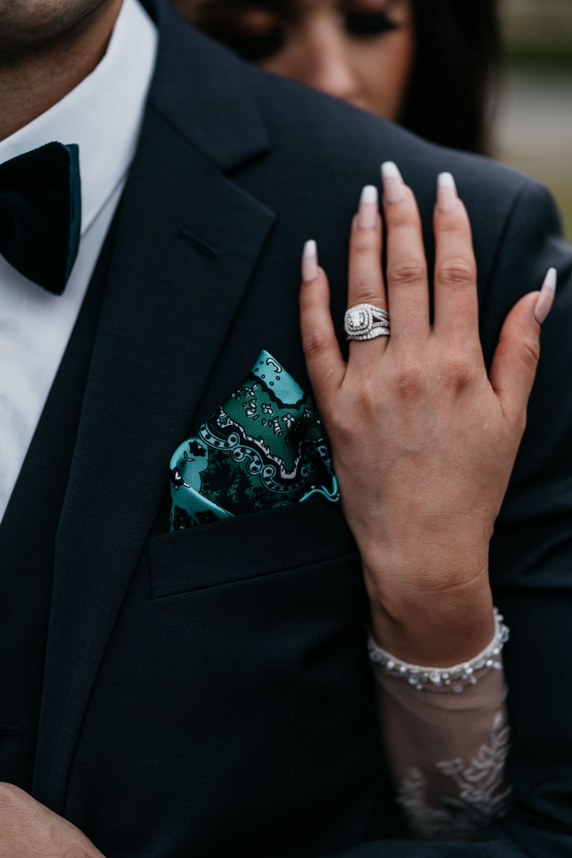 A close up of a woman 's hand with a ring on it