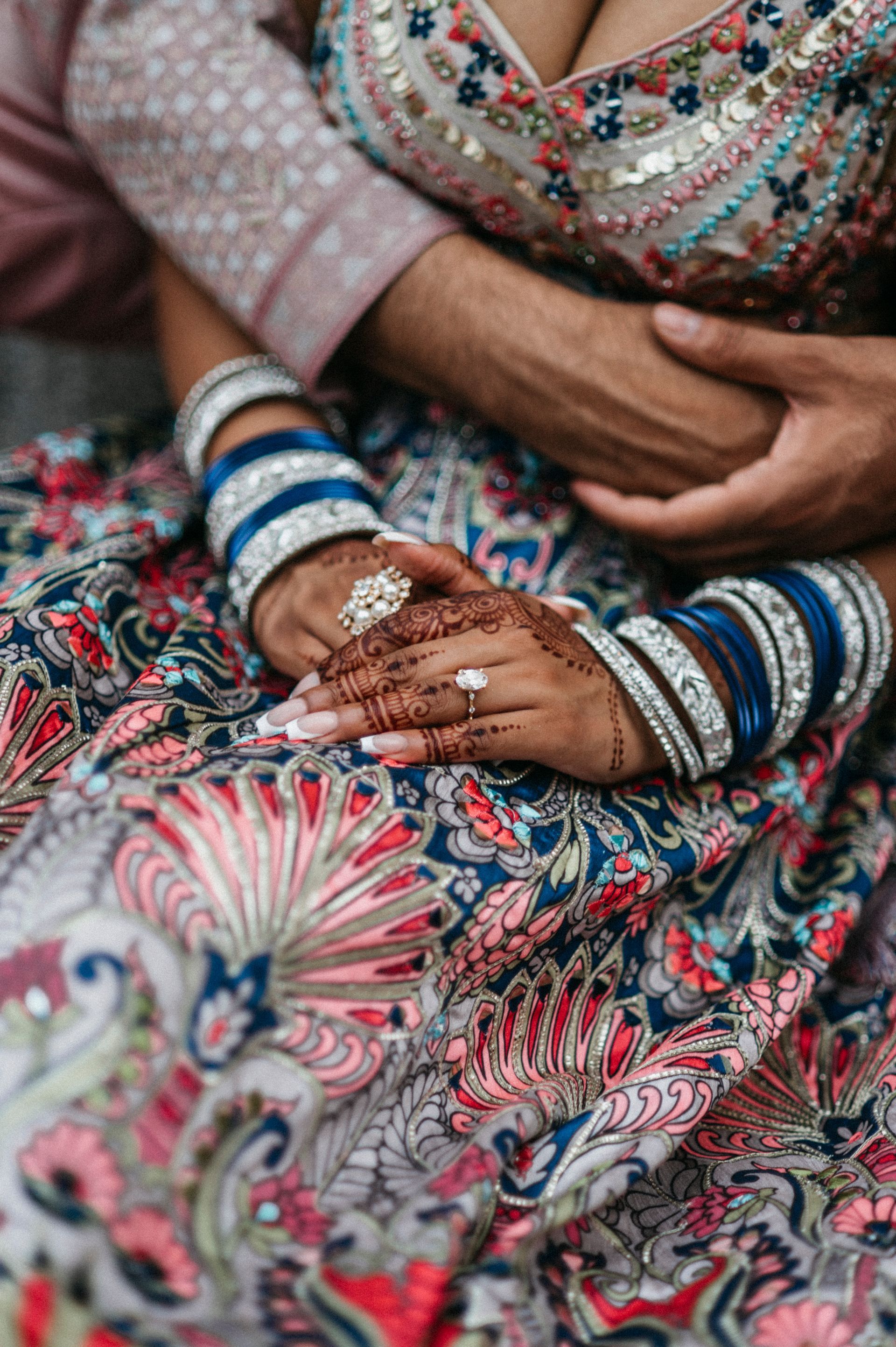 A close up of a woman 's hands with a ring on her finger.