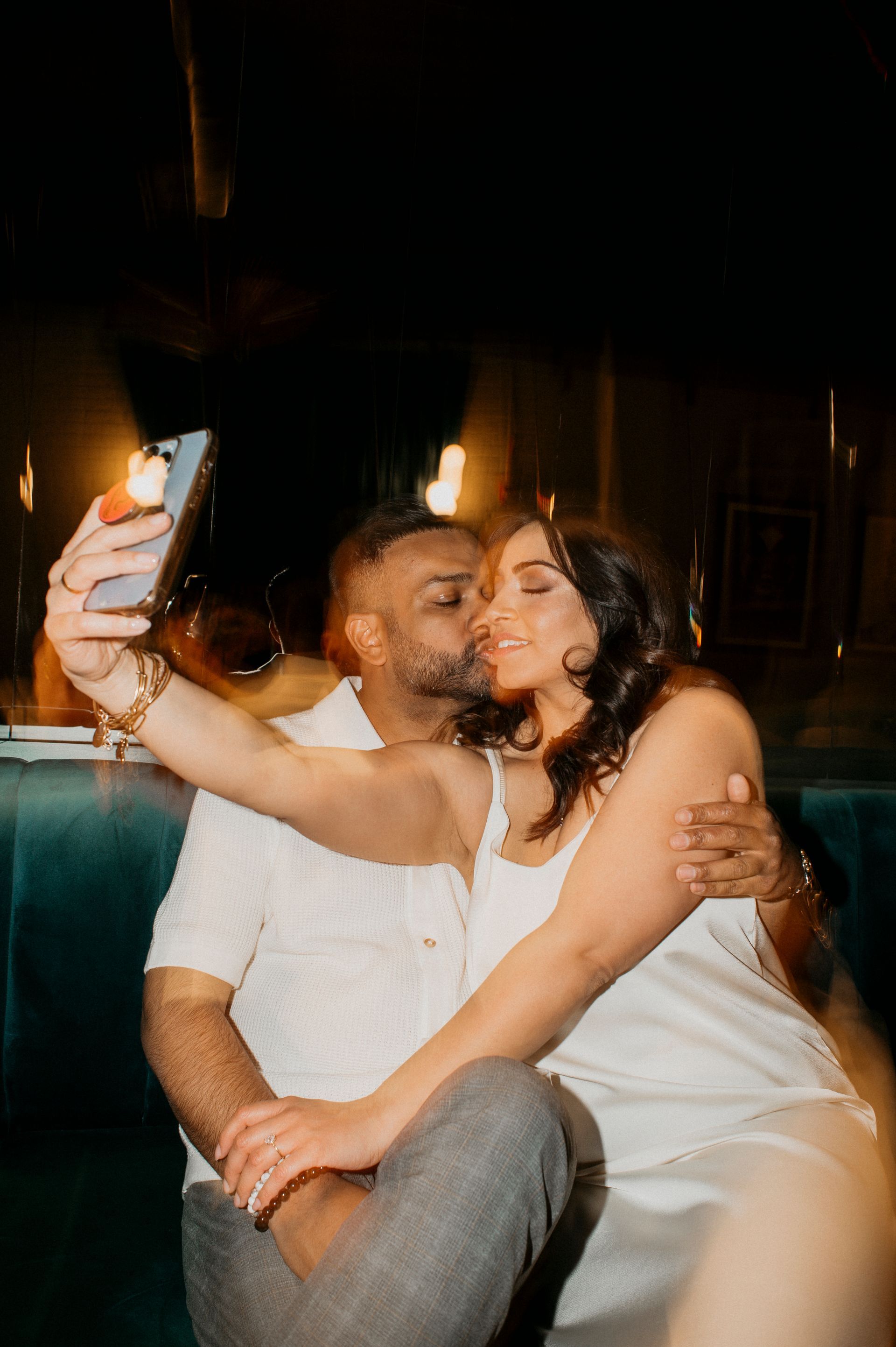A man and a woman are taking a selfie together.