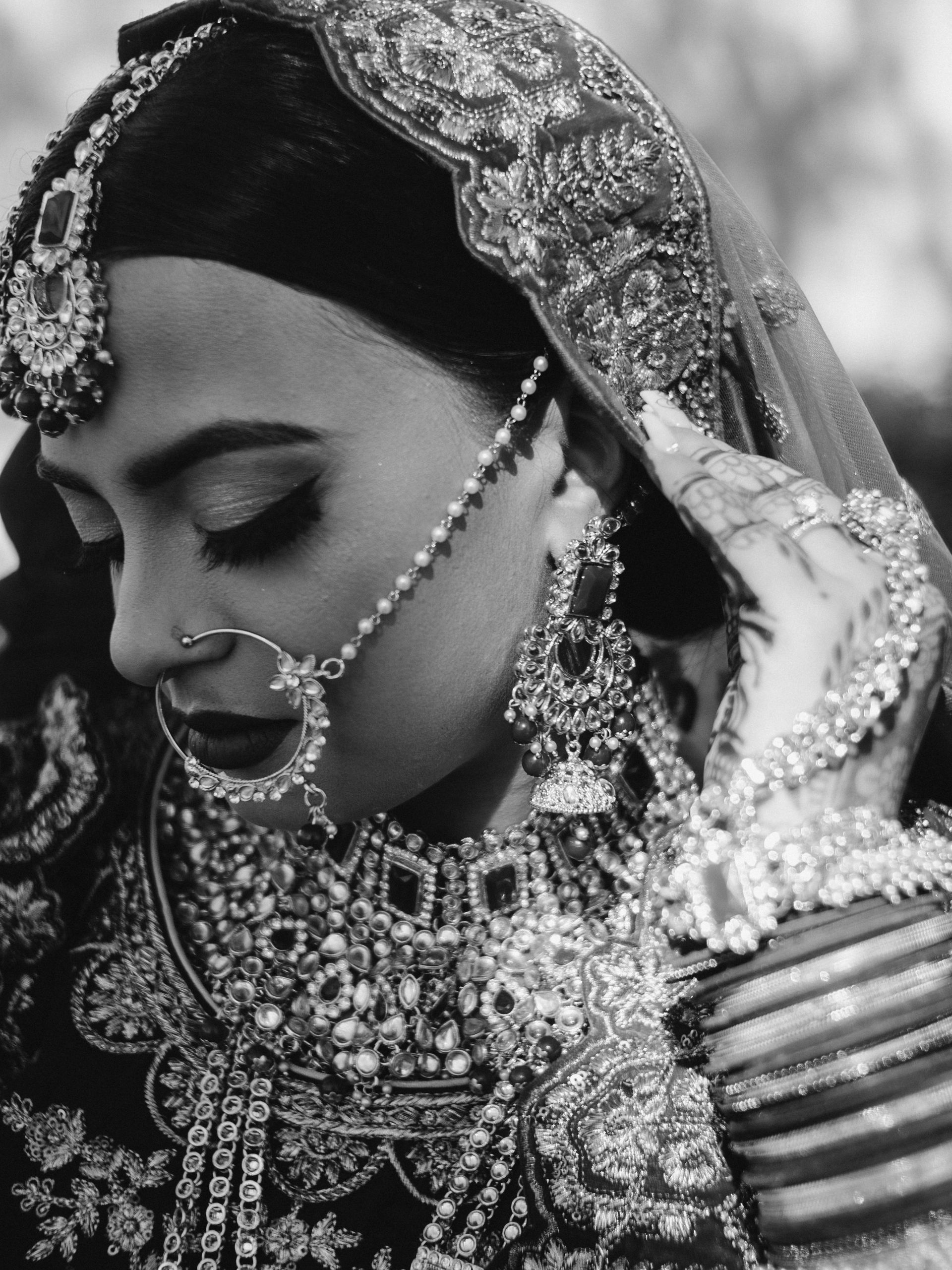 A black and white photo of a woman in a wedding dress
