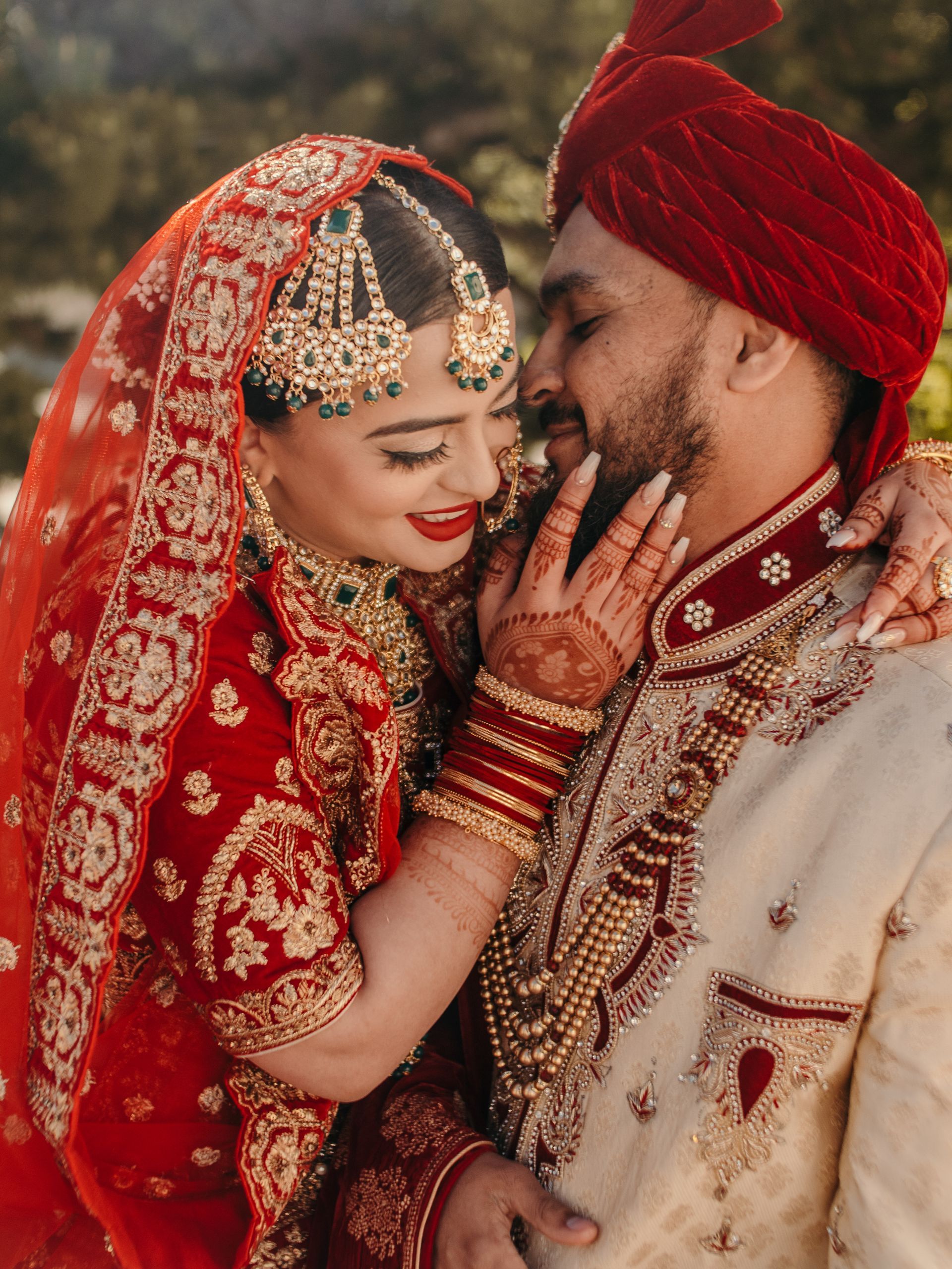 A bride and groom are posing for a picture on their wedding day.