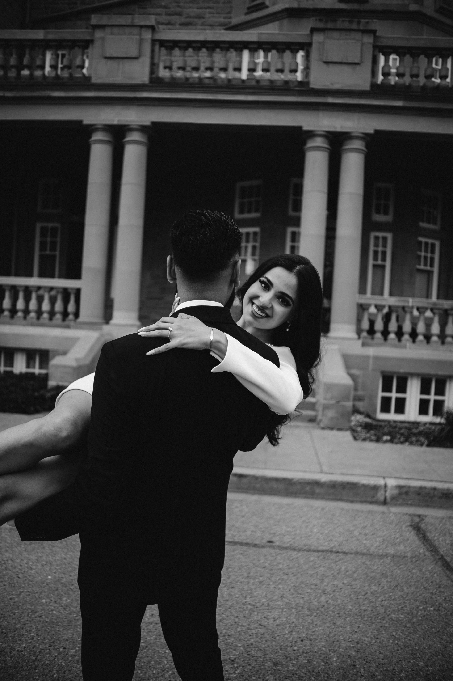 A restaurant with tables and chairs and a painting on the wall.