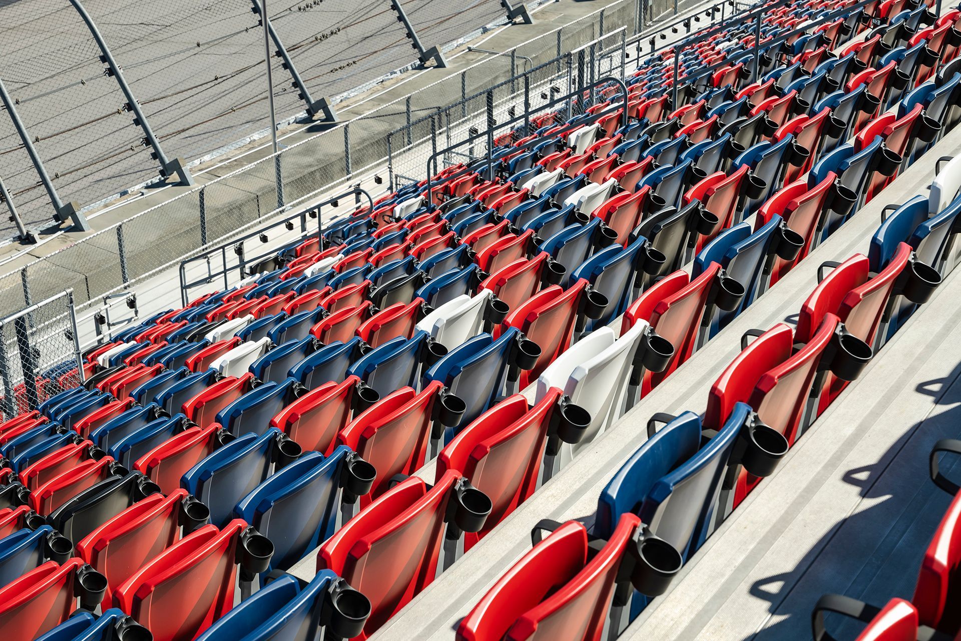 Darlington Raceway photos, featuring VISION Fixed Outdoor Chairs with armrests and cupholders.