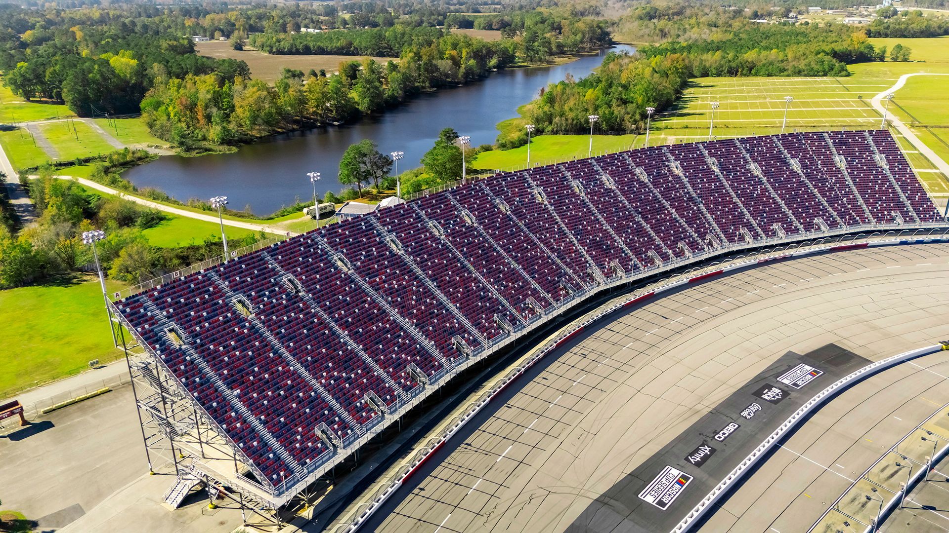 Darlington Raceway photos, featuring VISION Fixed Outdoor Chairs with armrests and cupholders.