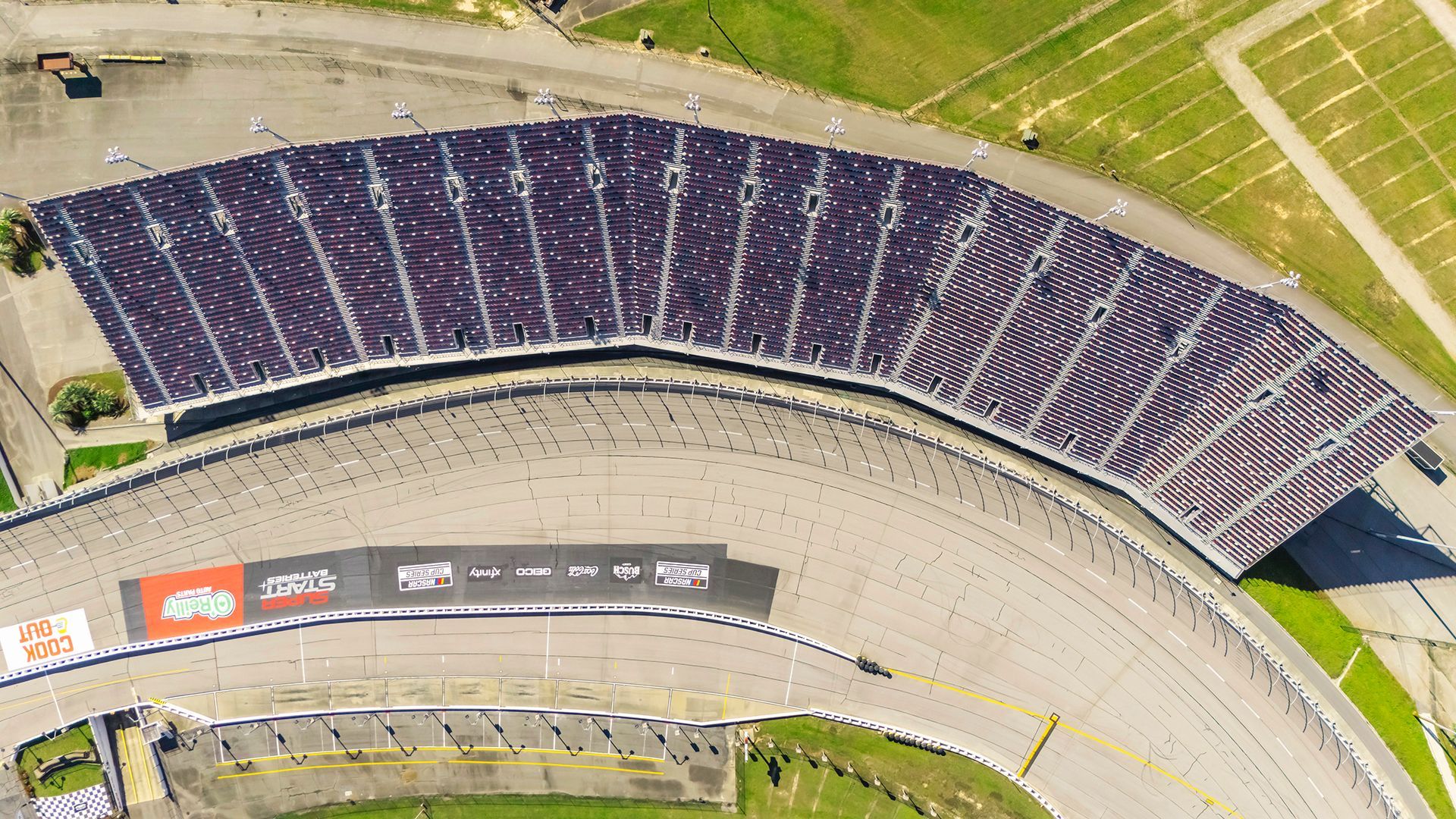 Darlington Raceway photos, featuring VISION Fixed Outdoor Chairs with armrests and cupholders.