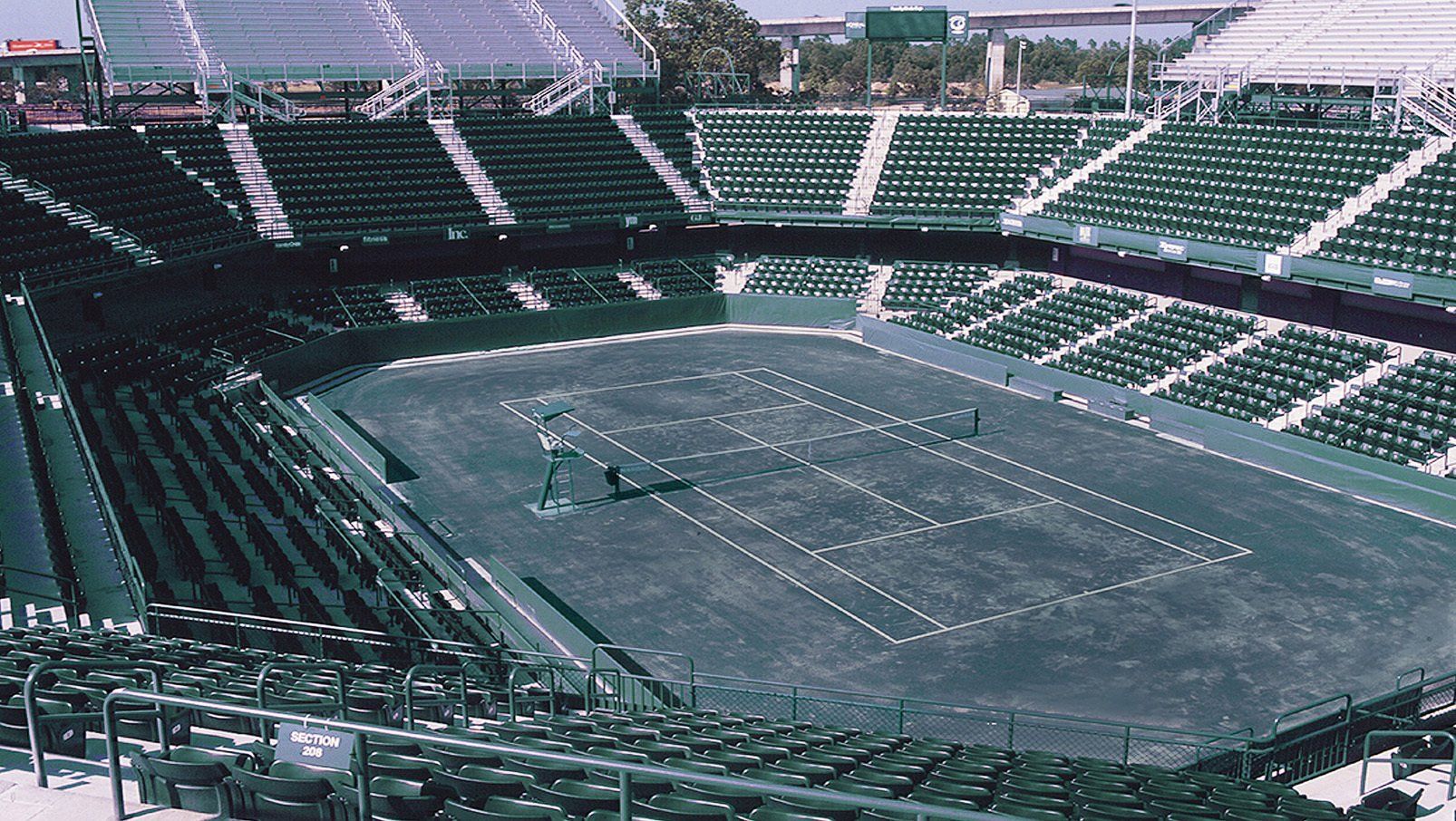 Green Interkal AURA Solid Stadium Chairs on the courts at Family Circle.