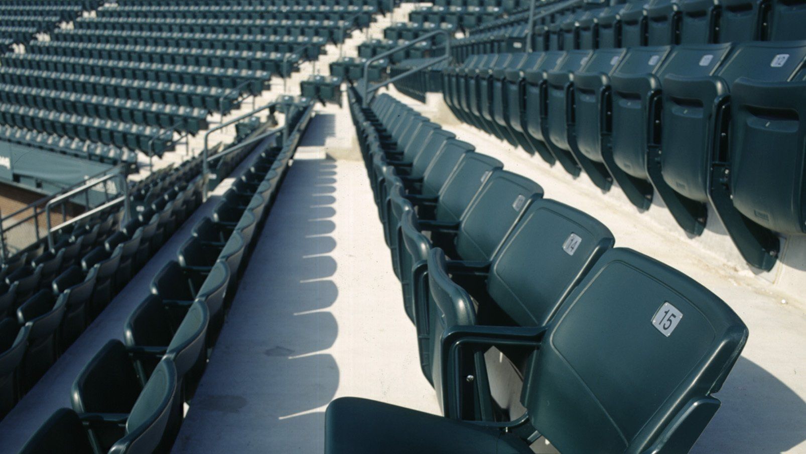 Green Interkal AURA Solid Stadium Chairs on the courts at Family Circle.