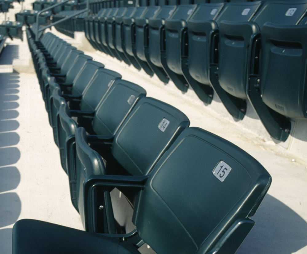 Green Interkal AURA Solid Stadium Chairs on the courts at Family Circle.