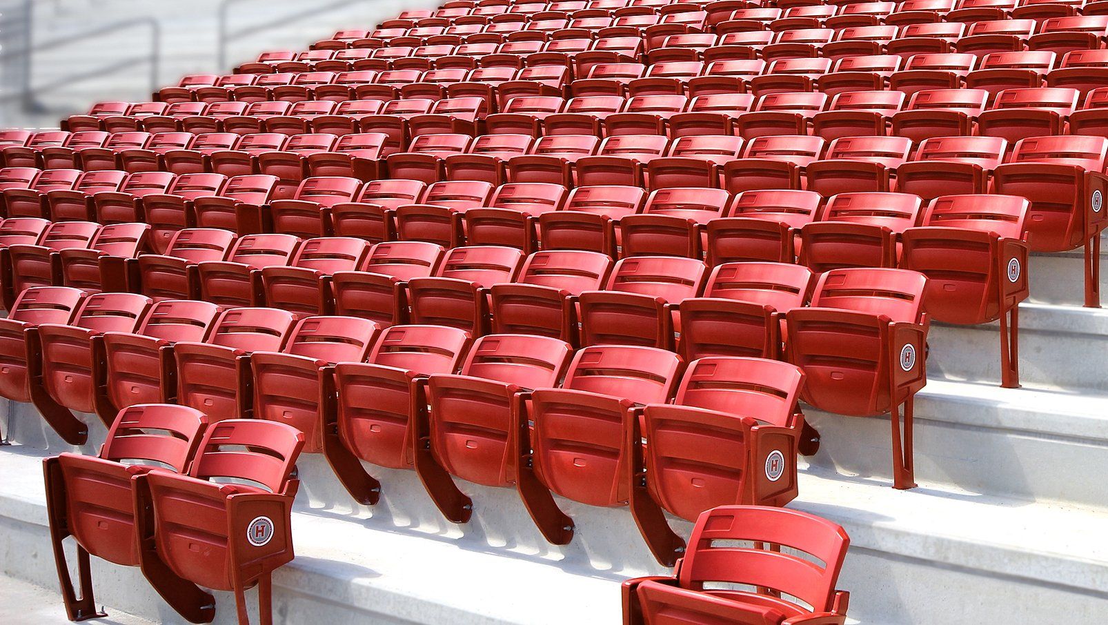 Red Interkal AURA Slat Stadium Chairs adorn the alumni section of the Hewitt-Trussville High School football stadium.