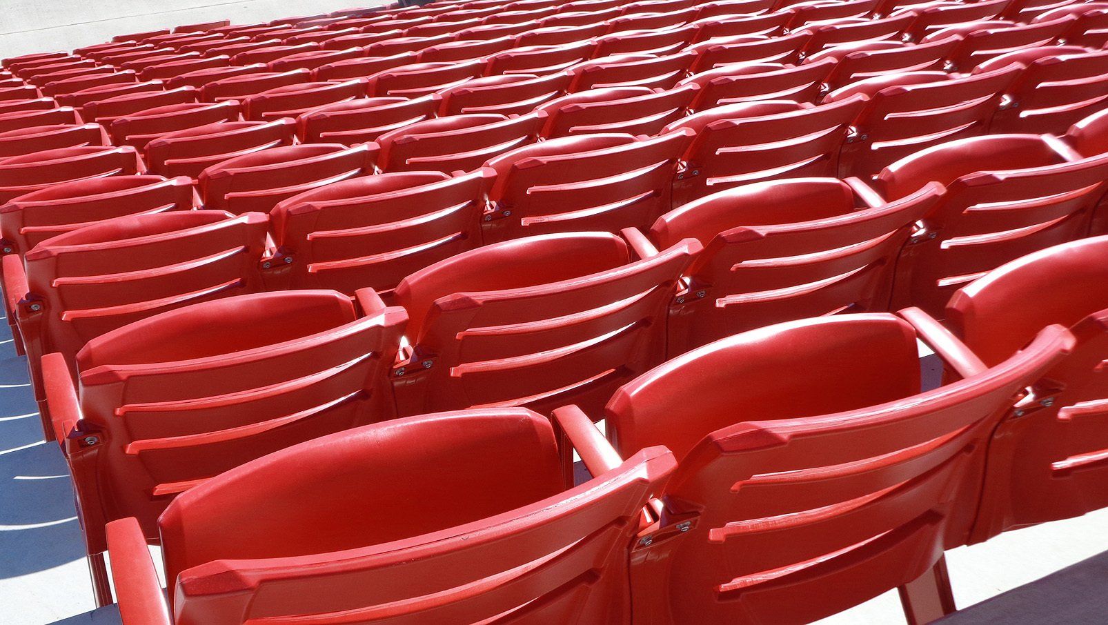 Red Interkal AURA Slat Stadium Chairs adorn the alumni section of the Hewitt-Trussville High School football stadium.