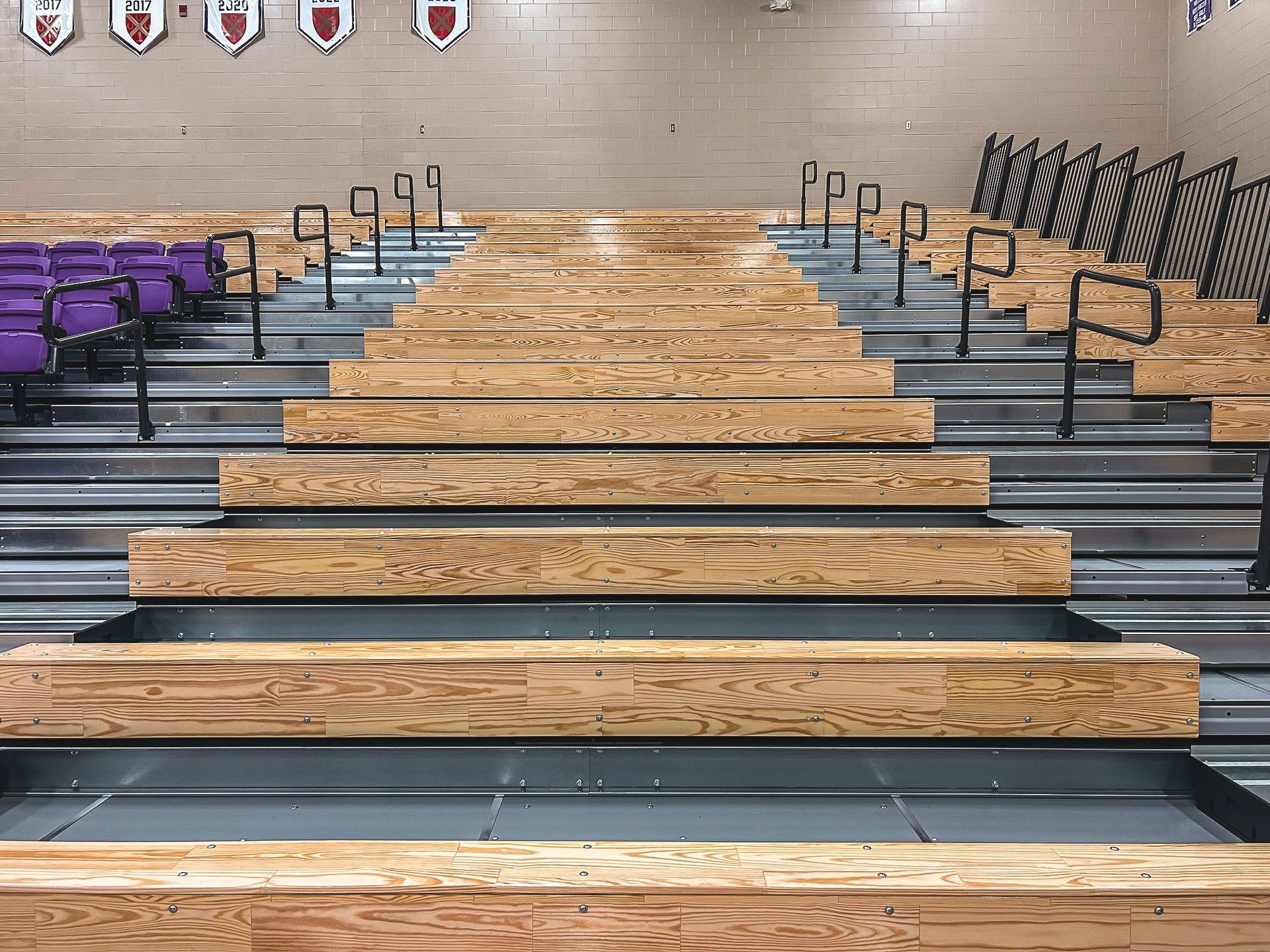 The telescopic bleacher system at Father Ryan High School in Tennessee, featuring a VIP section of VISION Platform chairs.