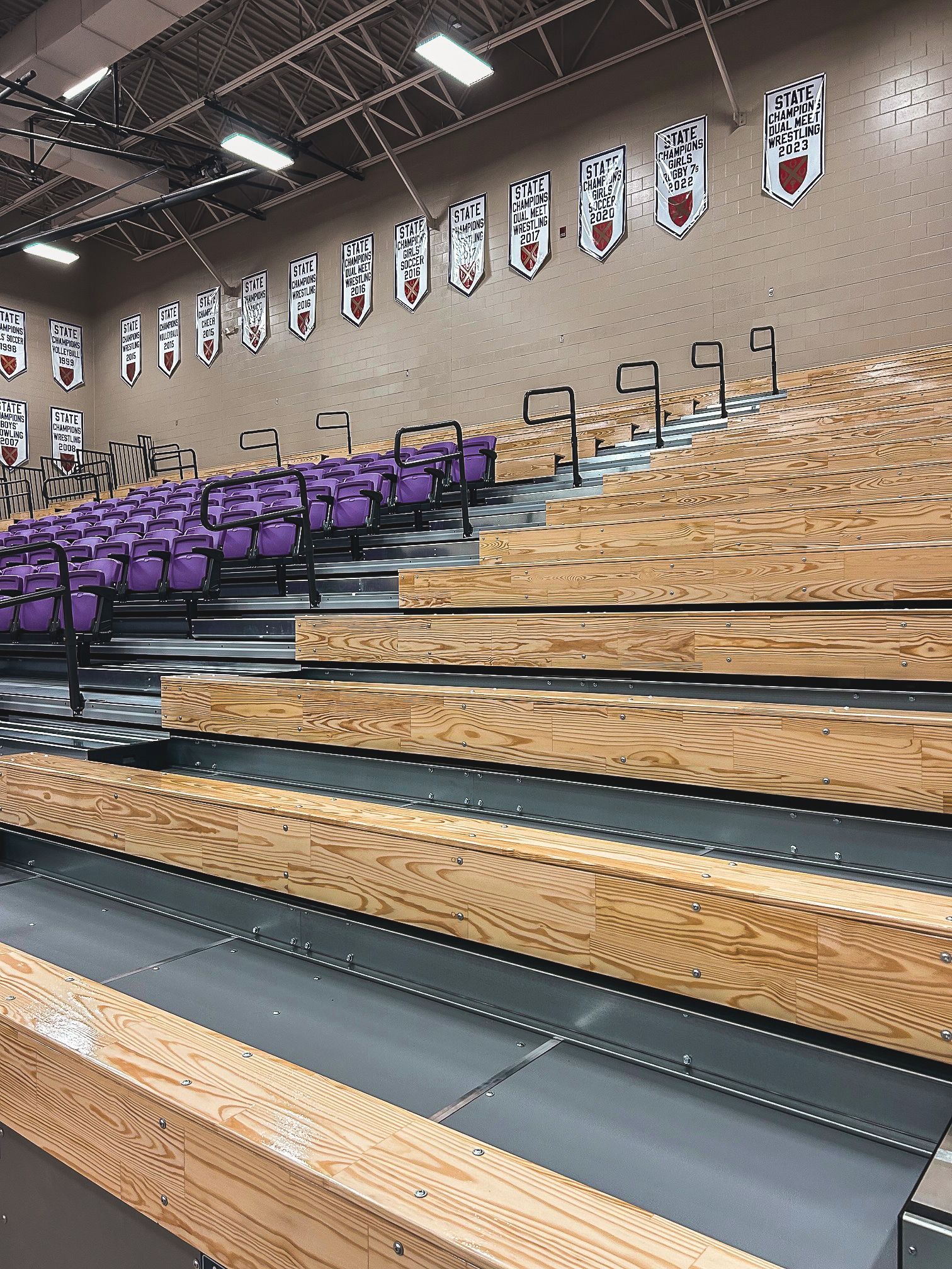 The telescopic bleacher system at Father Ryan High School in Tennessee, featuring a VIP section of VISION Platform chairs.