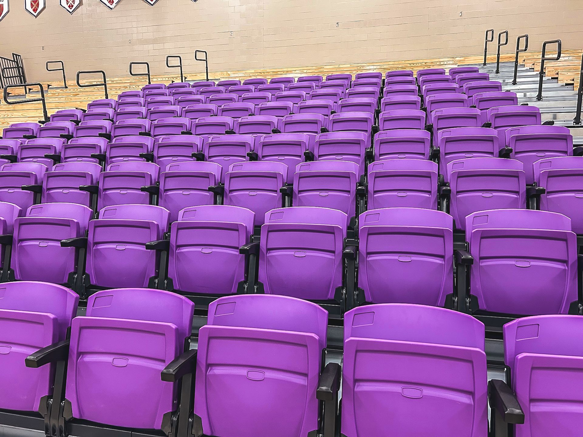 The telescopic bleacher system at Father Ryan High School in Tennessee, featuring a VIP section of VISION Platform chairs.