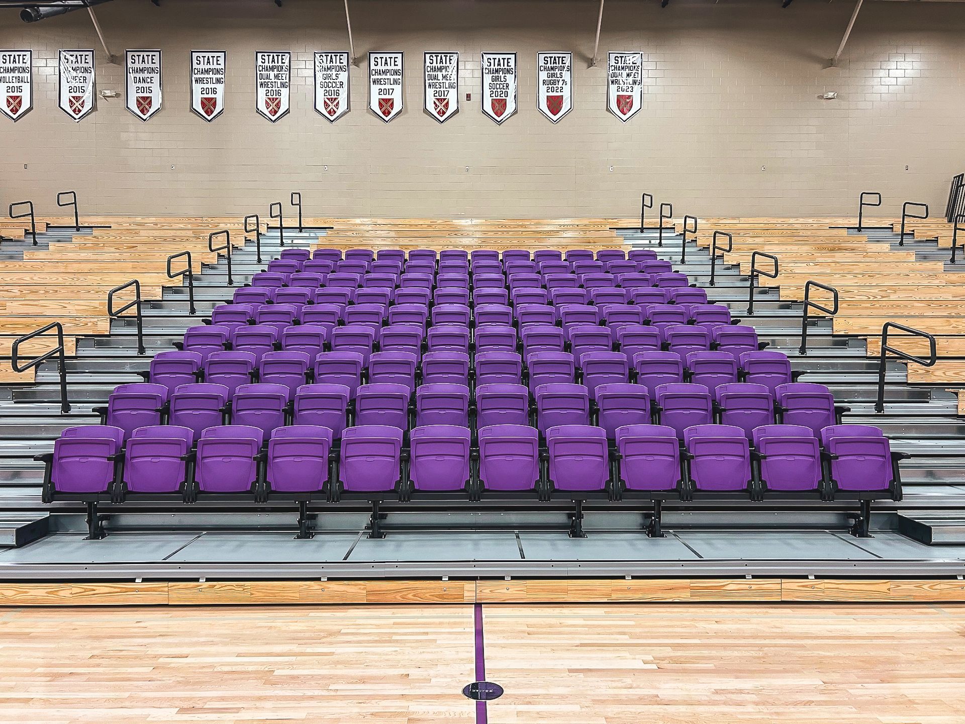 The telescopic bleacher system at Father Ryan High School in Tennessee, featuring a VIP section of VISION Platform chairs.