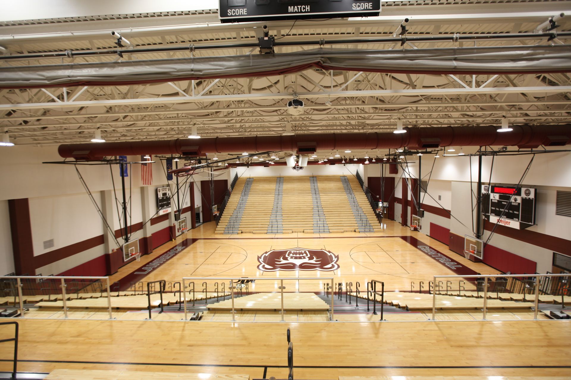 Classic Wood Bleachers with Self-Storing Aisle Rails (SSAR) in the gymnasium at Lawrence Central High School in Indiana.