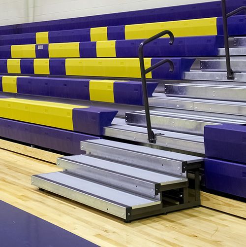 Portable step assemblies for telescopic bleacher installations