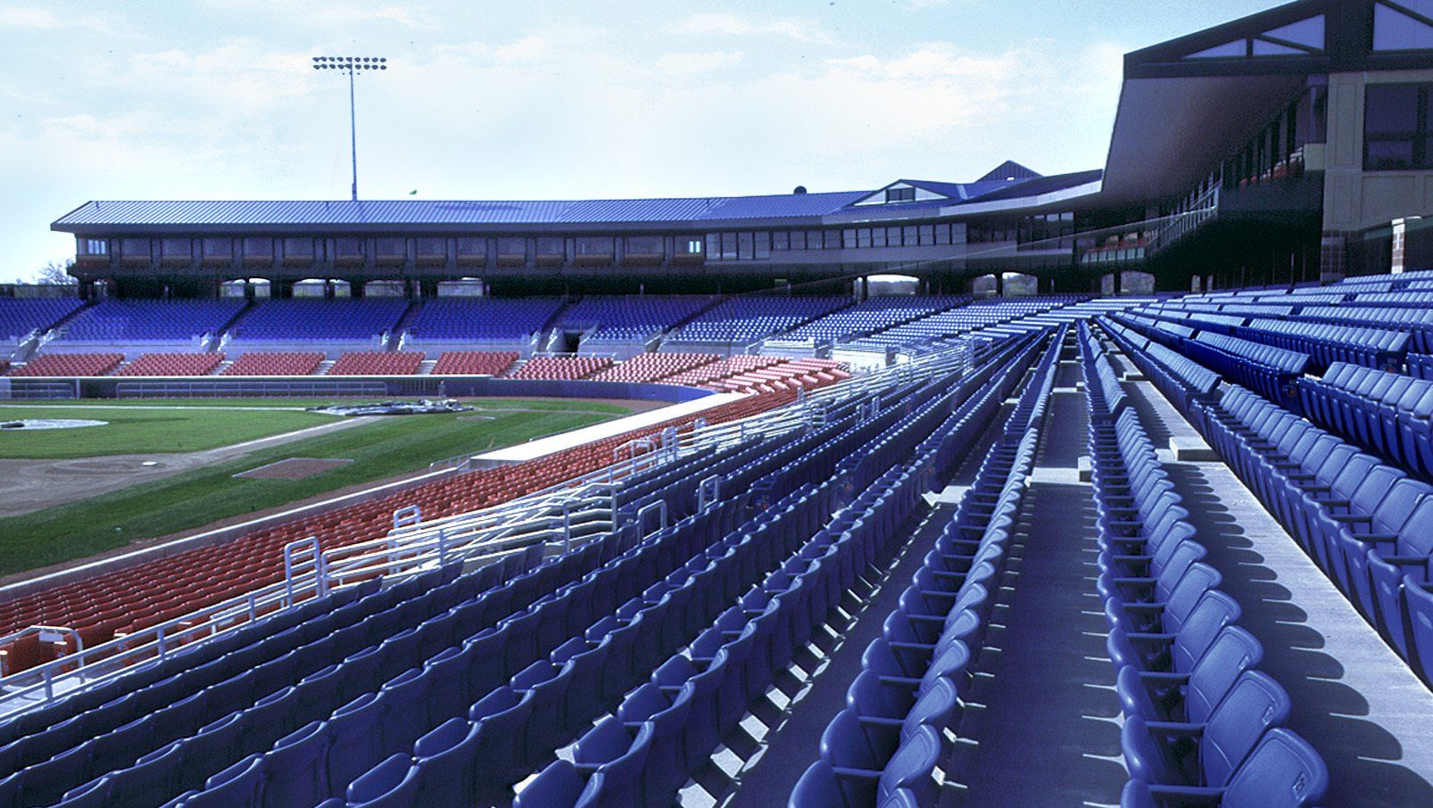 Blue and Red Interkal AURA Solid Stadium Chairs featured at Sec Taylor Stadium.