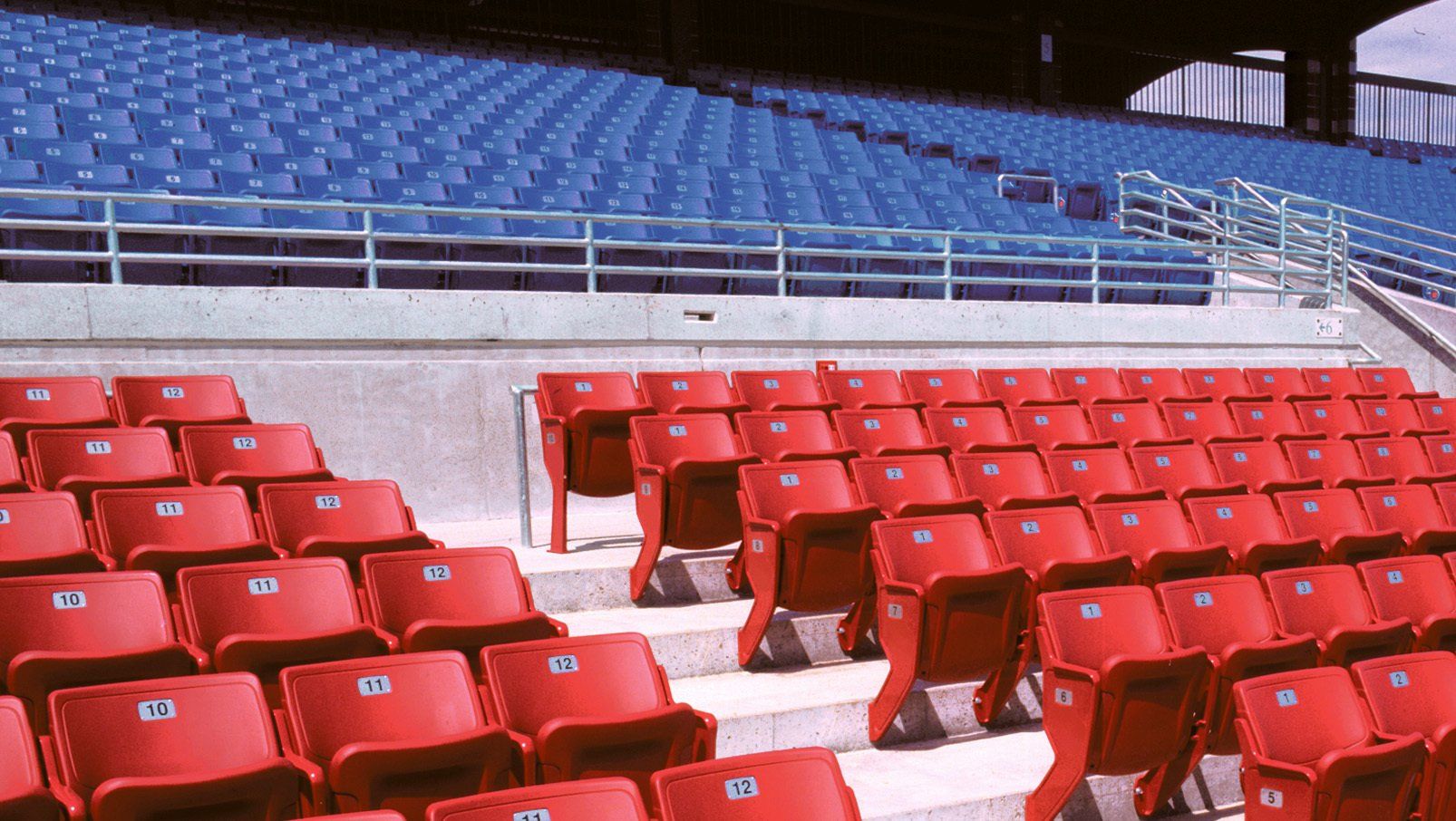 Blue and Red Interkal AURA Solid Stadium Chairs featured at Sec Taylor Stadium.