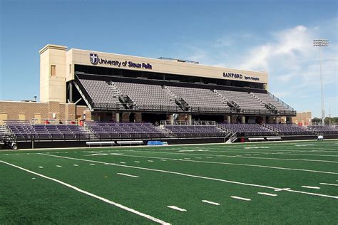 A multi-color use of purple and grey Interkal AURA Solid Stadium Chairs in the stadium at the University of Sioux Falls.