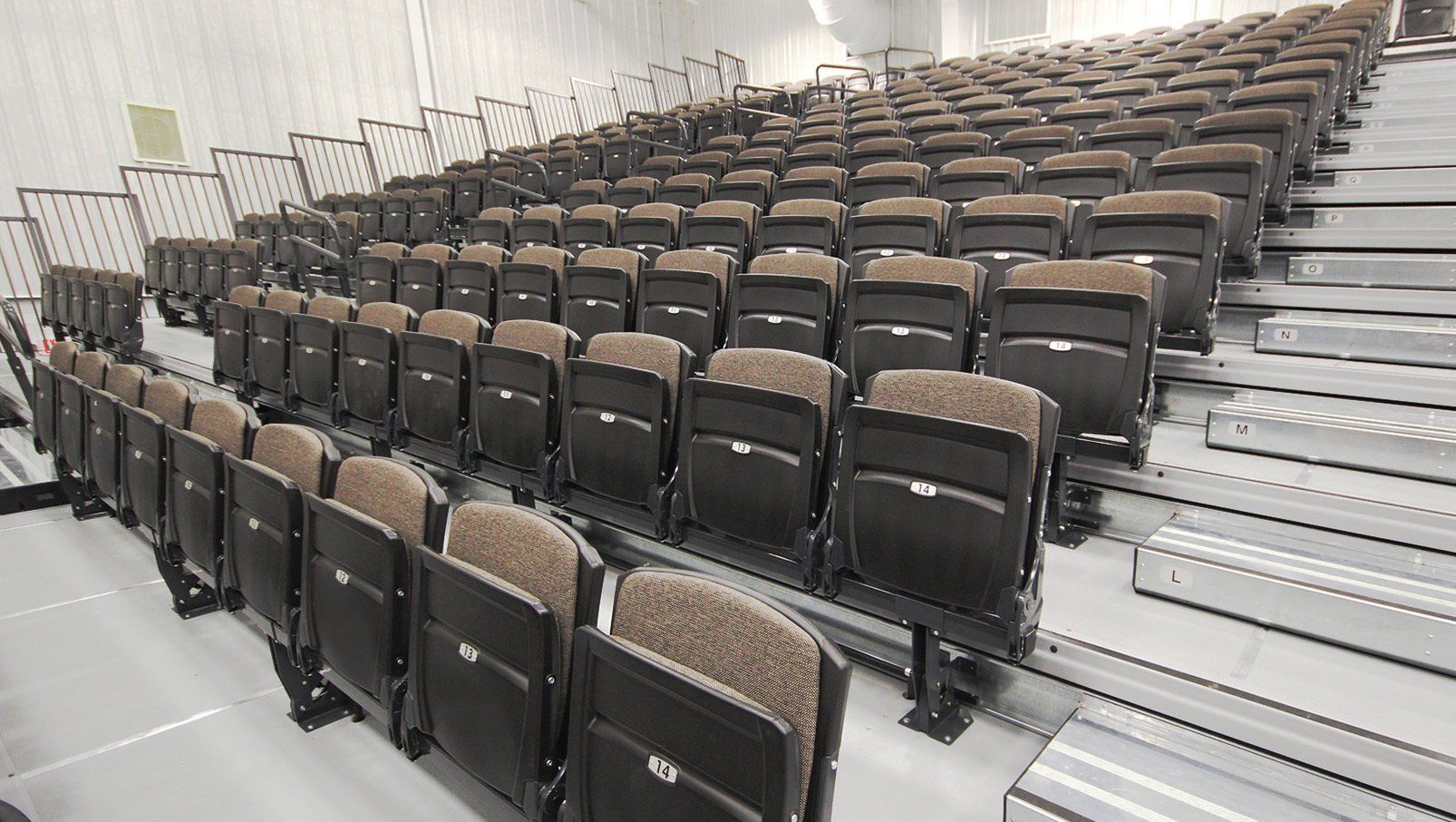 Interkal VISION Platform Chairs, fully upholstered, on a wide deck premier platform in the cafetorium at Tonkawa High School.