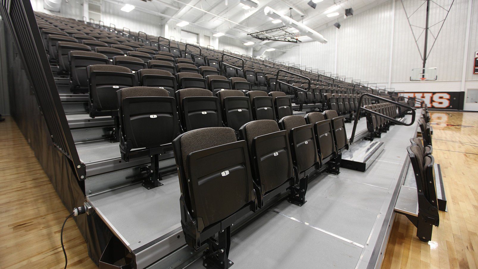 Interkal VISION Platform Chairs, fully upholstered, on a wide deck premier platform in the cafetorium at Tonkawa High School.
