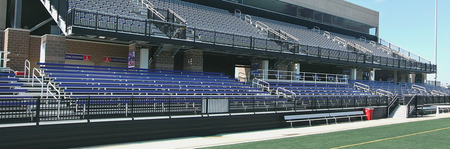 A multi-color use of purple and grey Interkal AURA Solid Stadium Chairs in the stadium at the University of Sioux Falls.