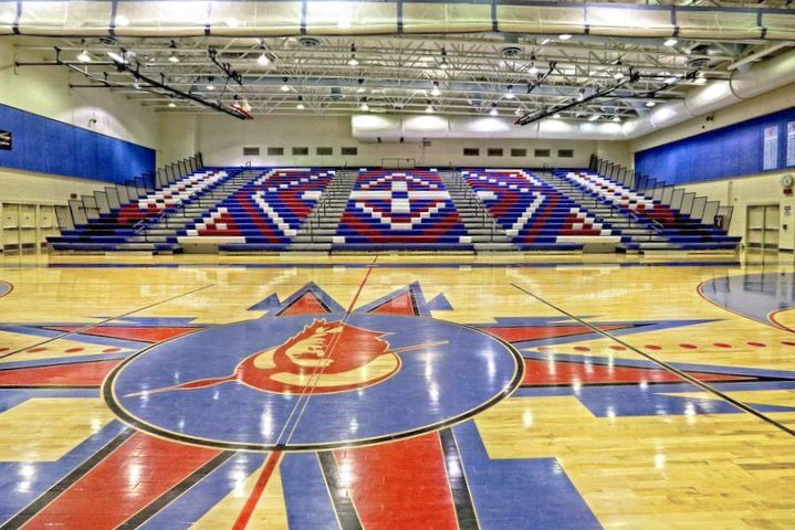 A bleacher stack that is designed to resemble a Native American tribal design, using different colors of Excel Seat Modules.